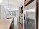 Modern kitchen island featuring a stainless steel sink and faucet, plus stainless steel appliances at 111 N 12Th St # 1619, Tampa, FL 33602