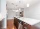 Open kitchen with hardwood floors, a large island, and stainless steel appliances at 111 N 12Th St # 1619, Tampa, FL 33602