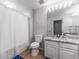 Bathroom featuring a toilet, shower, and marble-topped vanity at 1203 Bay Club Cir # 1203, Tampa, FL 33607