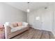 Bright bedroom with wood floors, daybed, and two closet doors at 1203 Bay Club Cir # 1203, Tampa, FL 33607