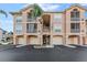 Exterior of a three-story condo with garage parking and balconies at 1203 Bay Club Cir # 1203, Tampa, FL 33607