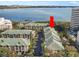 Spacious multi-unit building with lush landscaping, ample parking, and a tranquil waterfront view at 1203 Bay Club Cir # 1203, Tampa, FL 33607