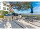 Outdoor grill area with grill, table, chairs, and a view of the water at 1203 Bay Club Cir # 1203, Tampa, FL 33607