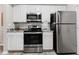 Efficient kitchen featuring stainless steel appliances, and bright cabinets, ready for meal preparation at 1203 Bay Club Cir # 1203, Tampa, FL 33607