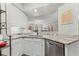 The updated kitchen showcases granite countertops, modern appliances, and ample cabinet space at 1203 Bay Club Cir # 1203, Tampa, FL 33607
