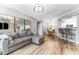 Cozy living room with modern flooring, neutral tones, and plenty of natural light. Open to dining area at 1203 Bay Club Cir # 1203, Tampa, FL 33607