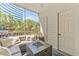 Relaxing screened lanai with comfortable seating, offering a private outdoor retreat with green views at 1203 Bay Club Cir # 1203, Tampa, FL 33607