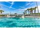 Sparkling pool with fountain feature, surrounded by lush landscaping and lounge chairs at 1203 Bay Club Cir # 1203, Tampa, FL 33607