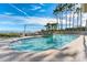Beautiful pool area featuring palm trees and stunning water views at 1203 Bay Club Cir # 1203, Tampa, FL 33607