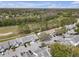 Aerial view showcasing community bordering the golf course and mature trees at 16211 Rambling Vine W Dr, Tampa, FL 33624