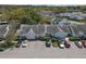 Aerial view of a tidy, well-maintained housing community with ample parking at 16211 Rambling Vine W Dr, Tampa, FL 33624