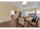 A dining area that connects to a living room with a fireplace and a screened in porch at 16211 Rambling Vine W Dr, Tampa, FL 33624