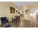 The dining area is spacious with wood floors, and is adjacent to the kitchen and living area at 16211 Rambling Vine W Dr, Tampa, FL 33624