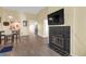 The inviting living room features a cozy fireplace, natural light, and wood flooring for a warm and inviting atmosphere at 16211 Rambling Vine W Dr, Tampa, FL 33624