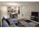 Comfortable living room area with a view of the kitchen and staircase at 17009 Clear Cork Dr, Wimauma, FL 33598
