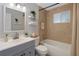 Well-lit bathroom showcasing a modern vanity, tiled shower, and fresh decor, providing a clean and relaxing space at 4925 Beacon Hill Dr, New Port Richey, FL 34652