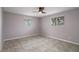 Bright bedroom featuring tile flooring and windows with lots of natural light at 4925 Beacon Hill Dr, New Port Richey, FL 34652