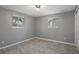 Bedroom with natural light let through the windows and features tile flooring at 4925 Beacon Hill Dr, New Port Richey, FL 34652