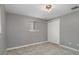 Bedroom featuring tile flooring and closet at 4925 Beacon Hill Dr, New Port Richey, FL 34652