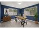 Bright office space with generous natural light, a modern desk setup, and sleek storage solutions, ideal for productivity at 4925 Beacon Hill Dr, New Port Richey, FL 34652