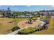 Aerial view of community amenities featuring a playground and landscaping at 6684 Devlin Ln, Wesley Chapel, FL 33545