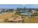 Aerial view of community amenities featuring a playground and landscaping at 6684 Devlin Ln, Wesley Chapel, FL 33545