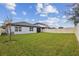 Expansive fenced backyard with lush green grass, perfect for outdoor living at 6684 Devlin Ln, Wesley Chapel, FL 33545