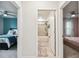 A bathroom is shown between two bedrooms at 6684 Devlin Ln, Wesley Chapel, FL 33545