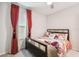 Charming bedroom features a cozy bed, unique decor, and bright natural light at 6684 Devlin Ln, Wesley Chapel, FL 33545