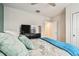 Inviting bedroom featuring ample storage and a comfortable bed with soft pillows and bright window at 6684 Devlin Ln, Wesley Chapel, FL 33545