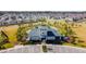 Aerial view of the community center with parking in a suburban neighborhood at 6684 Devlin Ln, Wesley Chapel, FL 33545