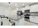 Kitchen with stainless steel appliances, granite countertops, and eat-in breakfast bar at 6684 Devlin Ln, Wesley Chapel, FL 33545