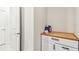 Bright laundry room features a wood countertop cabinet and plenty of open space at 6684 Devlin Ln, Wesley Chapel, FL 33545
