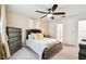 Serene main bedroom featuring a comfortable bed, neutral walls, ceiling fan, and carpeted flooring at 6684 Devlin Ln, Wesley Chapel, FL 33545
