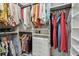 Large walk-in closet with hanging rods, drawers and shelving for optimal organization at 6684 Devlin Ln, Wesley Chapel, FL 33545