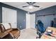 Bedroom with chair and desk, offering a peaceful spot for relaxation and study at 682 Olive Conch St, Ruskin, FL 33570