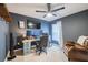 Bedroom with a ceiling fan, and a comfortable chair creating an ideal relaxation space at 682 Olive Conch St, Ruskin, FL 33570