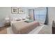 Serene bedroom with a plush bed, neutral tones, and decorative accents at 682 Olive Conch St, Ruskin, FL 33570