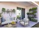 Outdoor patio with comfortable seating and lush greenery at 682 Olive Conch St, Ruskin, FL 33570