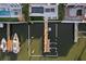 Aerial view of dock featuring boat lift and boat, next to swimming pool and waterfront access at 801 Brightwaters Ne Blvd, St Petersburg, FL 33704
