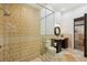 Primary bathroom featuring glass enclosed shower and pedestal sink with decorative mirror at 801 Brightwaters Ne Blvd, St Petersburg, FL 33704
