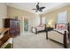 Bedroom with two beds, ceiling fan, and closet offers comfortable accommodations and ample natural light at 801 Brightwaters Ne Blvd, St Petersburg, FL 33704