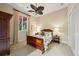 Comfortable bedroom with a wood sleigh bed, neutral walls, and soft carpeting at 801 Brightwaters Ne Blvd, St Petersburg, FL 33704