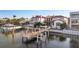 Newly constructed private dock with a boat lift ready for yachts and watercraft on a sunny day at 801 Brightwaters Ne Blvd, St Petersburg, FL 33704