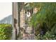 Charming courtyard entrance with brick pavers, decorative gate, and lush greenery at 801 Brightwaters Ne Blvd, St Petersburg, FL 33704