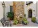 Exterior courtyard with a fountain and lush foliage near the front door at 801 Brightwaters Ne Blvd, St Petersburg, FL 33704