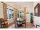 Cozy dining area with water view and stylish chandelier at 801 Brightwaters Ne Blvd, St Petersburg, FL 33704
