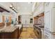 Gourmet kitchen with a spacious island, stainless steel appliances, and custom cabinetry at 801 Brightwaters Ne Blvd, St Petersburg, FL 33704