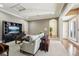 Spacious living room boasts plush seating, a modern entertainment center, and refined decor at 801 Brightwaters Ne Blvd, St Petersburg, FL 33704