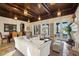 Spacious living room with tile floors, fireplace, and access to the outdoor space at 801 Brightwaters Ne Blvd, St Petersburg, FL 33704